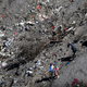 French gendarmes and investigators work amongst the debris of the Airbus A320 at the site of the crash, near Seyne-les-Alpes, French Alps.
